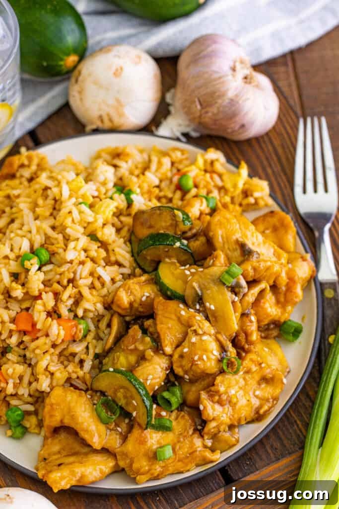 Homemade Panda Express Mushroom Chicken 2 Plate with copycat Panda Express Mushroom Chicken and fried rice, showcasing a delicious homemade meal