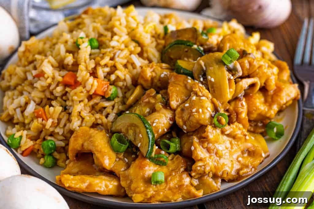 Homemade Panda Express Mushroom Chicken 6 Mushroom chicken recipe on plate with fried rice, garnished with green onions and sesame seeds