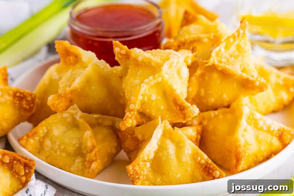 Crispy Crab Clouds 17 crab rangoon on plate with sweet chili sauce