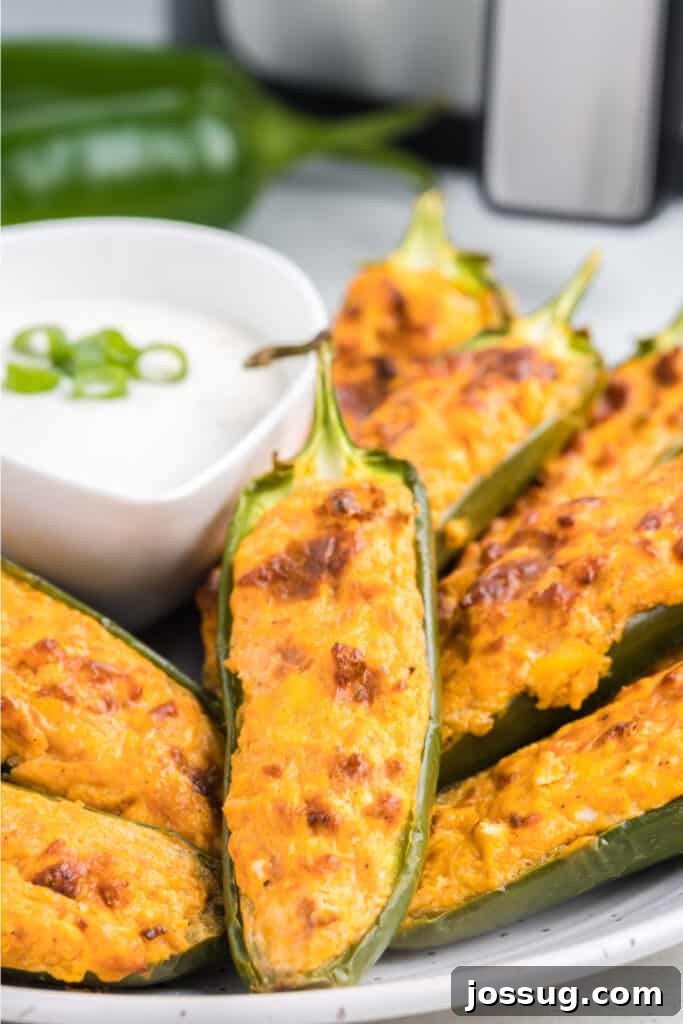air fryer buffalo chicken jalapeno poppers on plate to serve