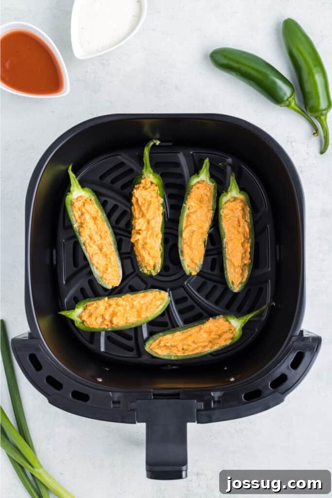 Add a single layer of jalapenos to the air fryer. Cook at 375 degrees F for 5-8 minutes or until the filling is bubbly and golden and the peppers are tender. You do not need to preheat the air fryer. Depending on your air fryer's size, you may need to cook them in batches.
