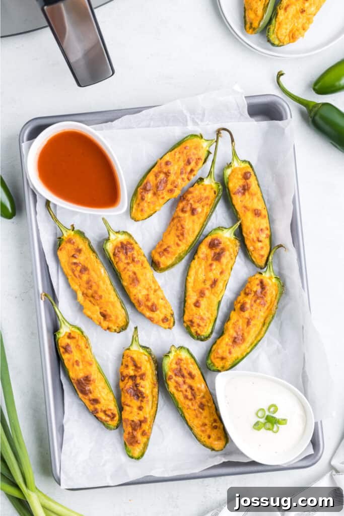 Allow the jalapenos to rest for 3-5 minutes so the filling firms slightly, and serve with ranch, blue cheese dressing, or your favorite dipping sauce.