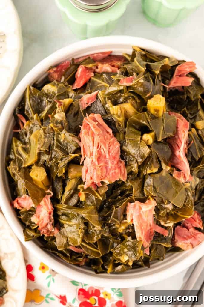 Soulful Southern Greens 2 closeup of cooked southern style collard green with ham hocks in a bowl