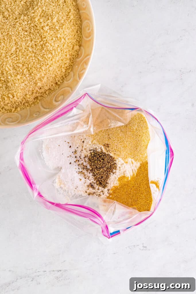 In a large plastic bag, mix flour, garlic powder, onion powder, salt, and pepper.