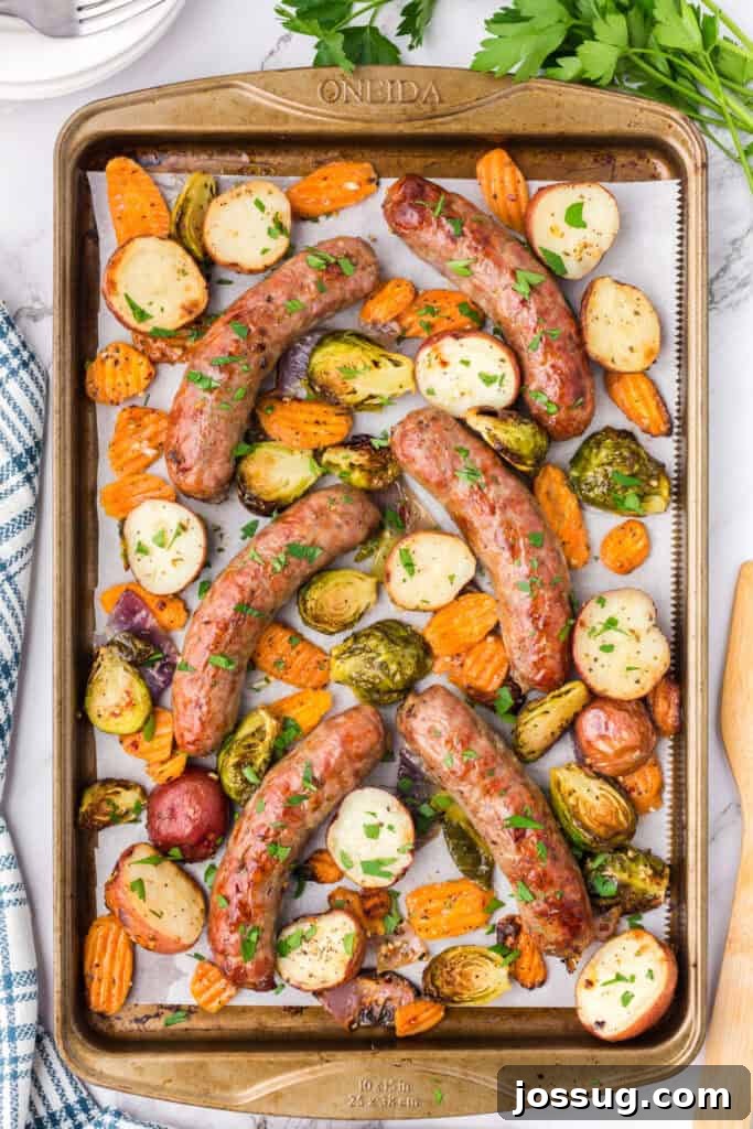 Roasted Sausage and Veggie Medley 2 cooked sausage and veggies on baking sheet, ready to serve