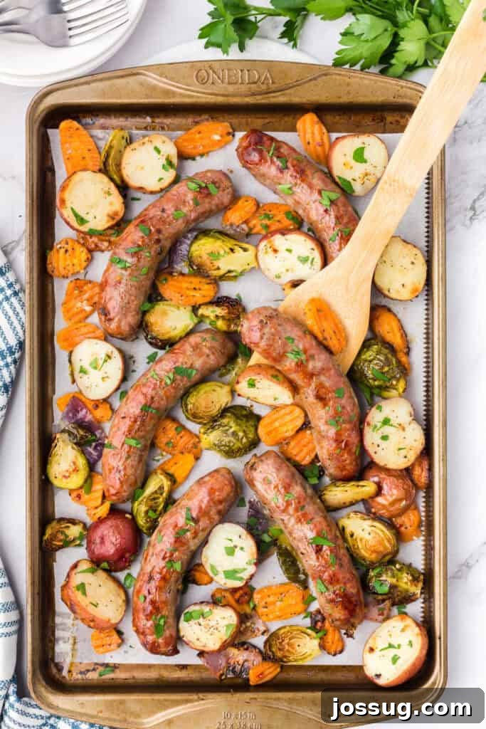 Roasted Sausage and Veggie Medley 4 sheet pan meal with sausage and veggies ready to be served from the pan