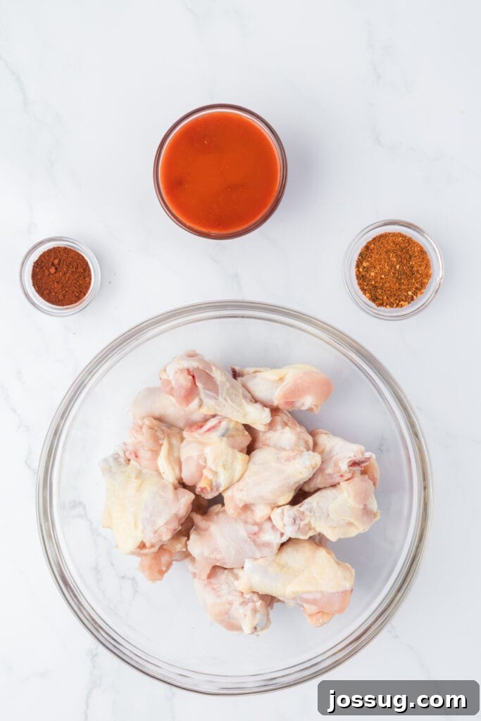 Perfectly Crispy Air Fryer Buffalo Wings 3 Ingredients laid out to make buffalo wings