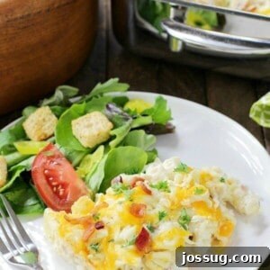A deliciously golden and bubbly Chicken Bacon Ranch Pasta Casserole in a baking dish.