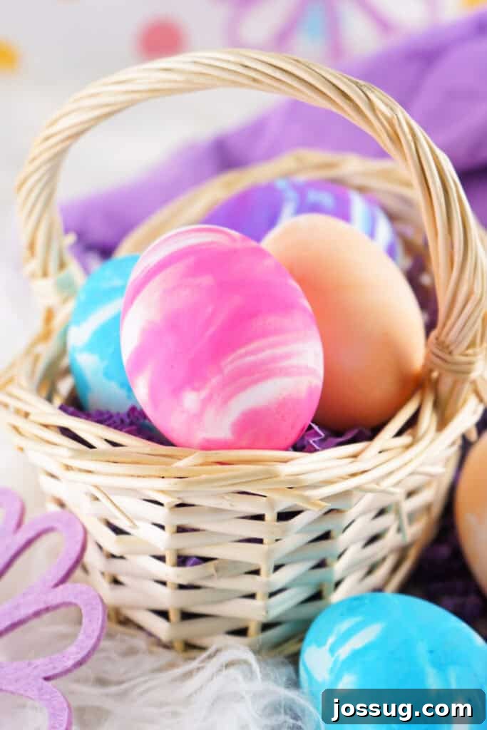 Cool Whip Marbled Easter Eggs 8 A brown basket filled with a variety of cool whip dyed Easter eggs in different colors and patterns