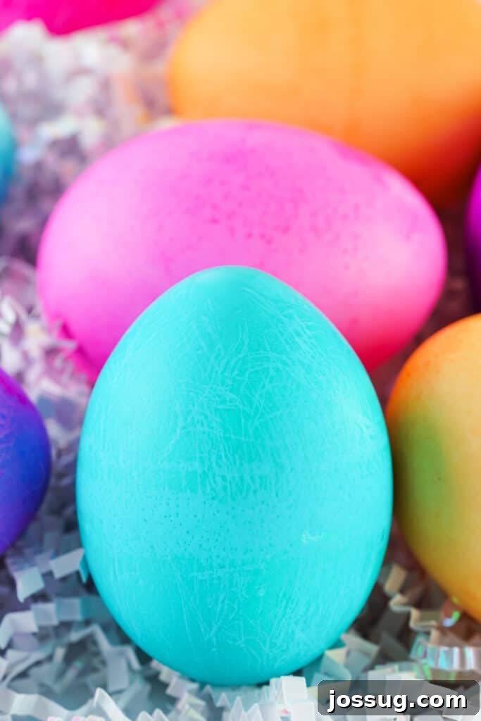 Assorted vibrant food coloring dyed Easter eggs displayed beautifully