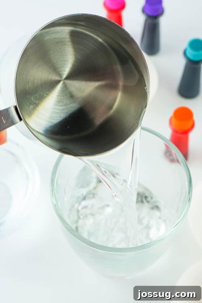 Adding water to a bowl in preparation for dyeing Easter eggs
