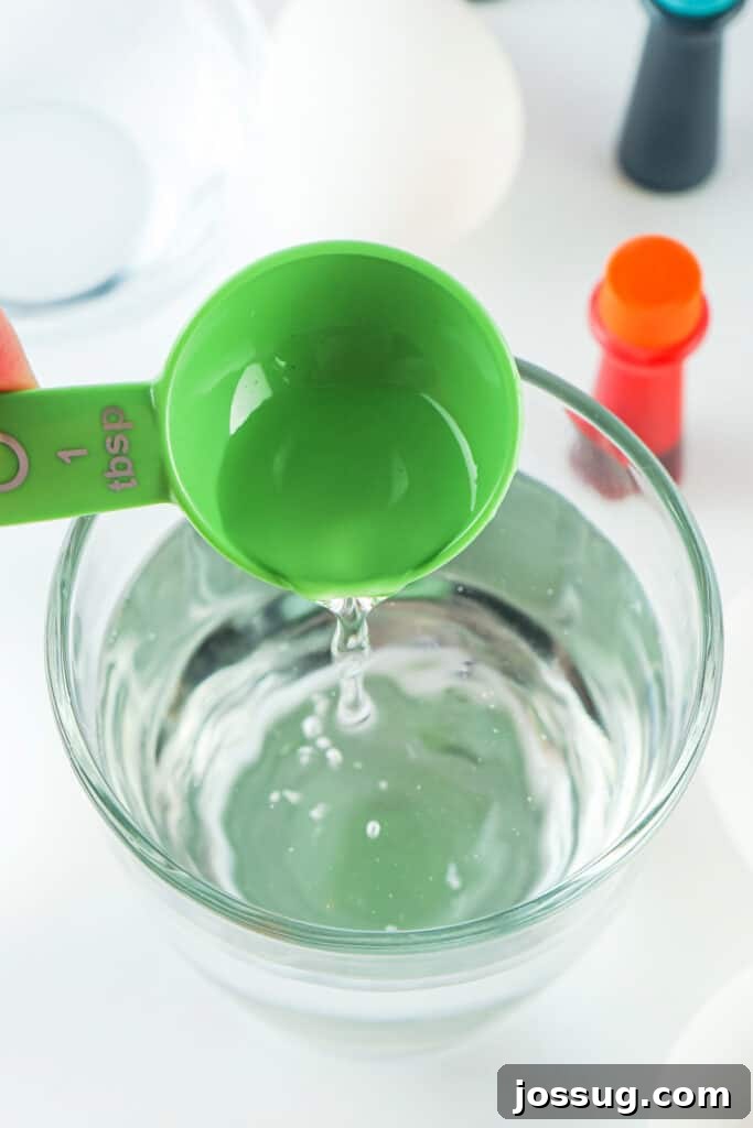 Adding white distilled vinegar to the water for Easter egg dye