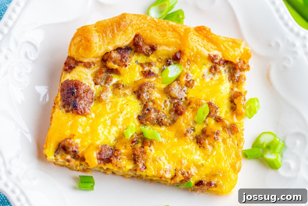 A perfectly baked slice of brunch pizza served on a white plate, ready to be enjoyed