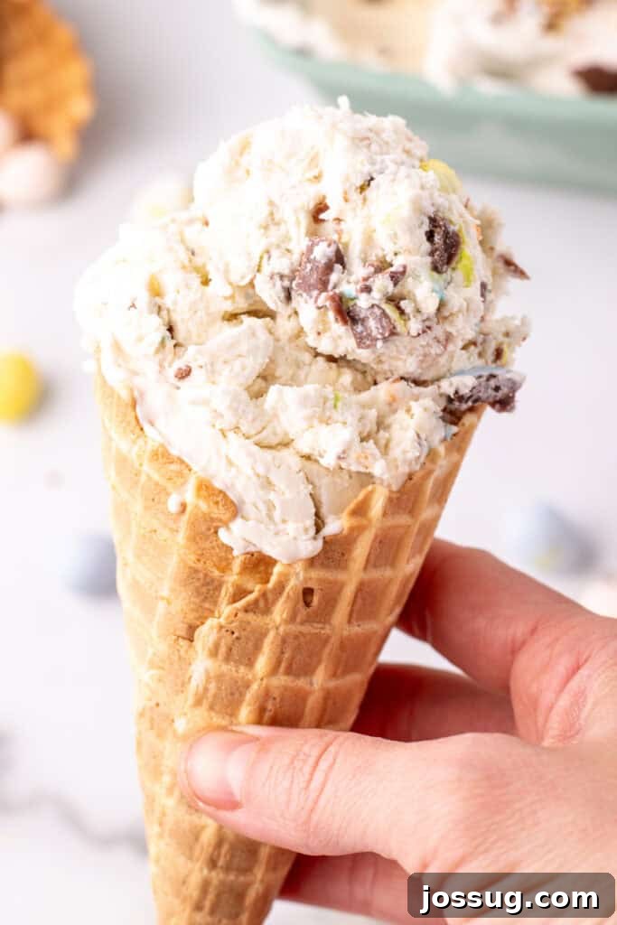 hand holding an ice cream cone with cadbury mini egg ice cream
