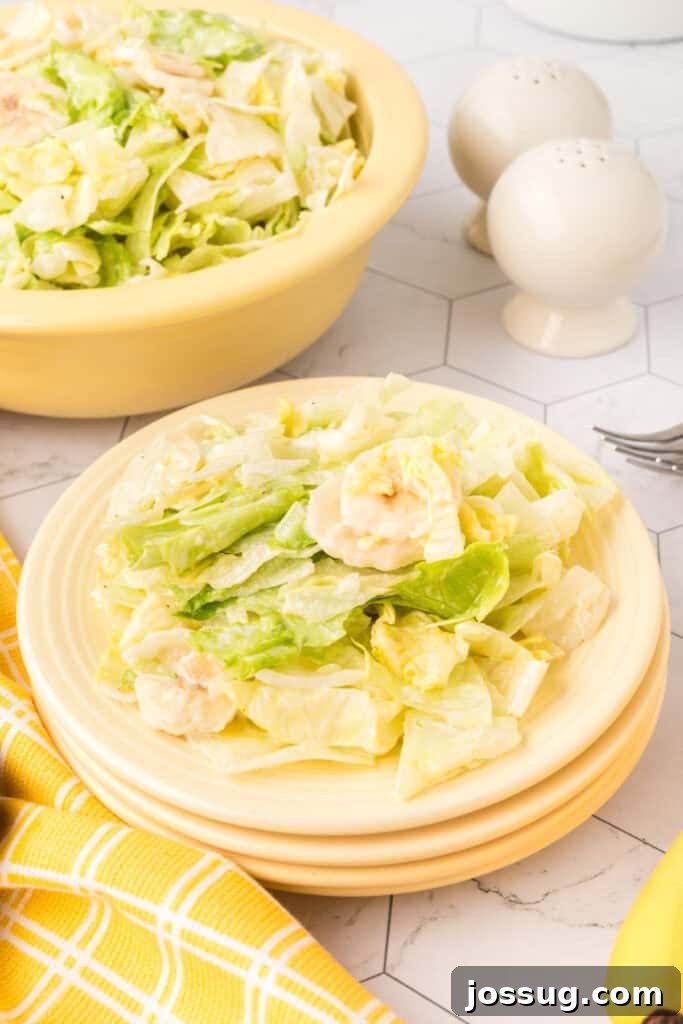 Grandma's Banana Lettuce Salad 2 Old Fashioned Banana Lettuce Salad served on a white plate, highlighting crisp lettuce and neatly sliced bananas.