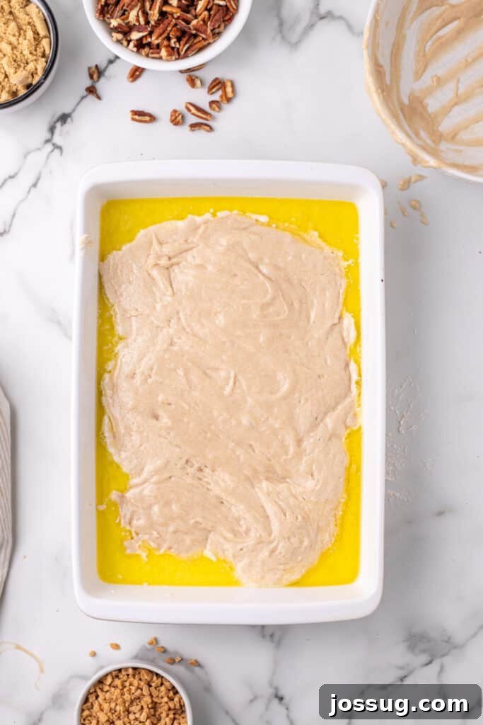 Decadent Pecan Cobbler 4 Pecan Pie Cobbler batter and melted butter in baking dish