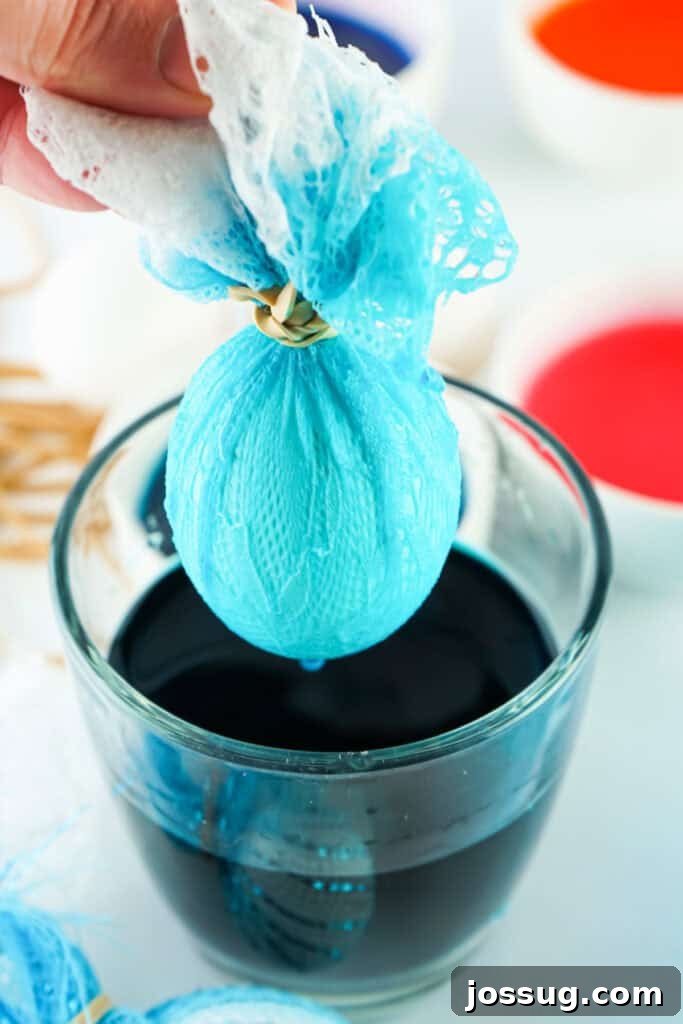 Textile Art Easter Eggs 5 Lace-wrapped Easter egg immediately after being dipped in dye, still wet.