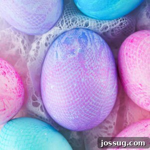 Closeup of assorted colors fabric textured Easter eggs, showing vibrant patterns and textures.