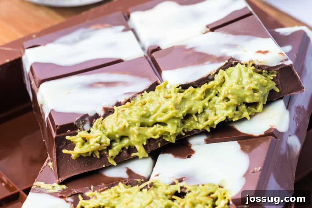 Golden Dubai Delight 18 Macro shot of a cross-section of the Dubai Chocolate Bar showing gooey pistachio filling with kataifi strands and chocolate layers.