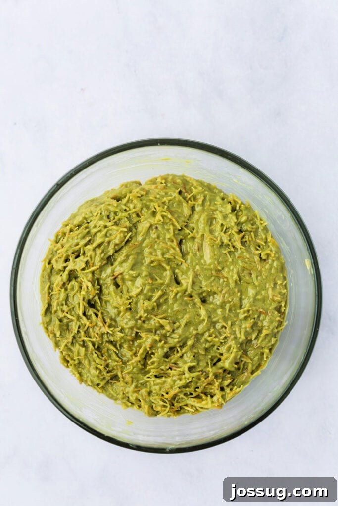 Golden Dubai Delight 9 Final filling mixture of pistachio butter, tahini, and toasted kataifi fully combined in a glass bowl.