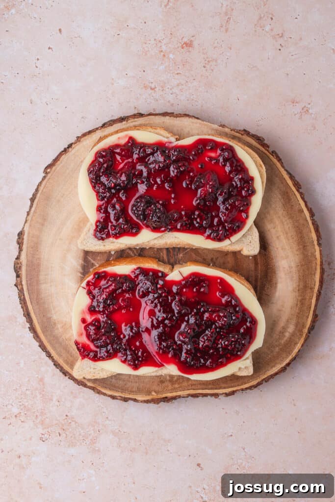 Sweet and Savory Blackberry Grilled Cheese 8 Provolone-topped bread slices generously covered with a layer of homemade blackberry jam