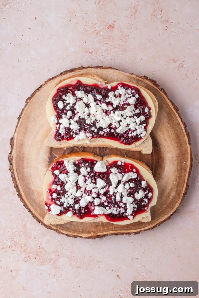 Sweet and Savory Blackberry Grilled Cheese 9 Blackberry jam layer elegantly topped with crumbled goat cheese on the sandwich base