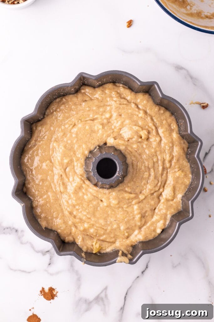 Tropical Spiced Bundt Cake 7 Hummingbird Bundt Cake batter carefully poured into a prepared Bundt pan.