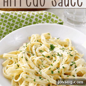Homemade Alfredo Sauce in a white bowl, garnished with parsley