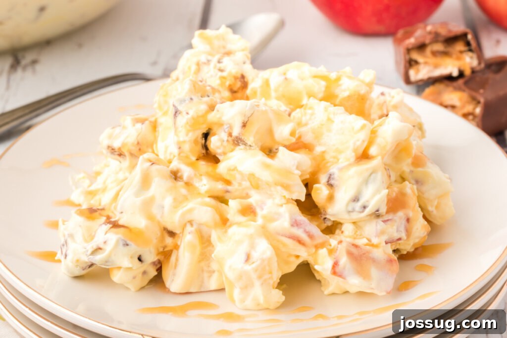 A full plate of Caramel Apple Snickers Salad, ready to be enjoyed.