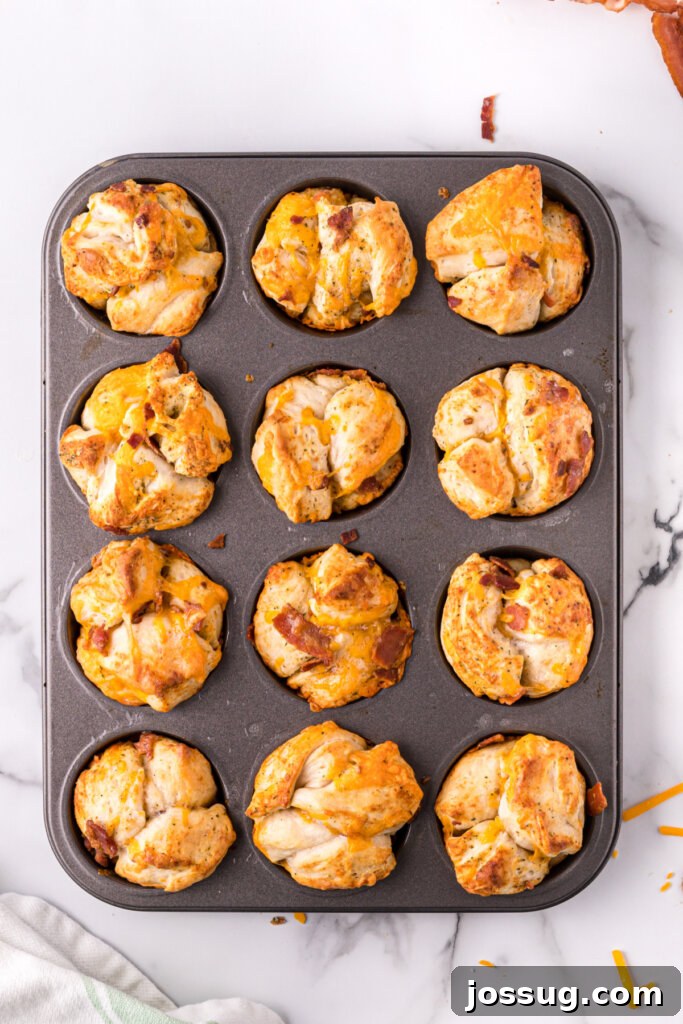Loaded Bacon Cheddar Ranch Bread 7 cheddar bacon ranch pull apart rolls fresh out of the oven in a muffin tin, golden brown and delicious