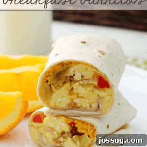 Hearty Bacon and Egg Breakfast Burritos 3 Bacon & Egg Breakfast Burritos stacked on a white plate, garnished and ready.