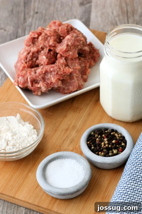 Hearty Homestyle Sausage Gravy 3 Fresh ingredients for making homemade sausage gravy laid out on a kitchen counter
