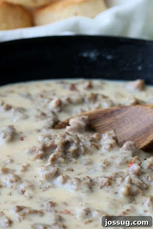 Hearty Homestyle Sausage Gravy 8 Southern sausage gravy in a cast iron skillet, golden and bubbling