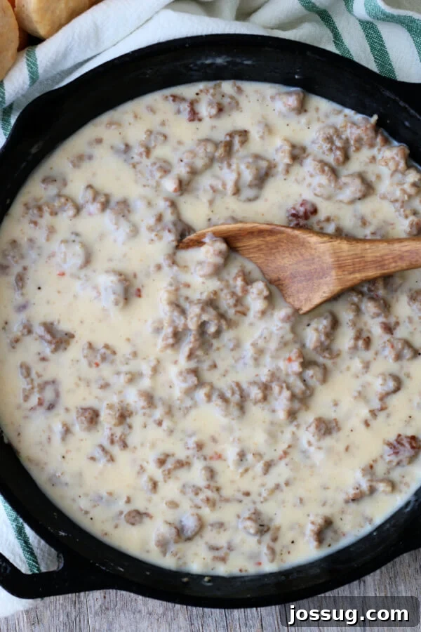 Hearty Homestyle Sausage Gravy 9 Looking down into a pan with finished sausage gravy, rich and creamy