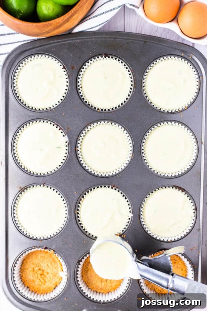 Zesty Mini Key Lime Cheesecakes 5 Cupcake pan filled with mini key lime cheesecakes before baking, next to a bowl of limes and eggs