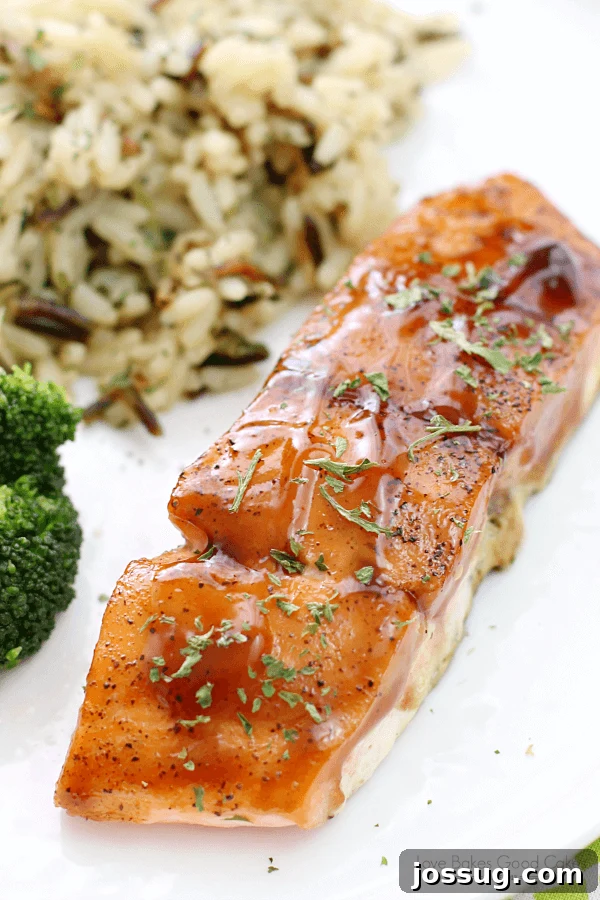 Dr Pepper Lacquered Salmon 2 Dr Pepper Glazed Salmon on a white plate with rice pilaf.