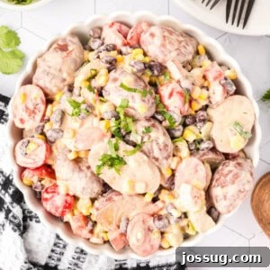 Overhead square image of Southwest Potato Salad served in a white dish, perfect for Pinterest.