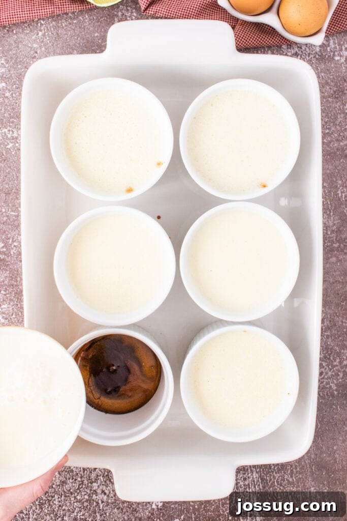 Caramel Flan Bites 8 Six ramekins filled with flan custard before baking, one showing a slightly burnt top.