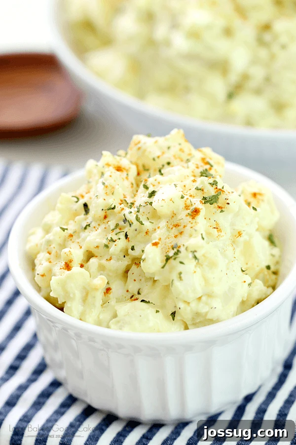 Homestyle Potato Salad 2 Creamy Old-Fashioned Potato Salad in a white bowl, shown close up for texture and inviting presentation.