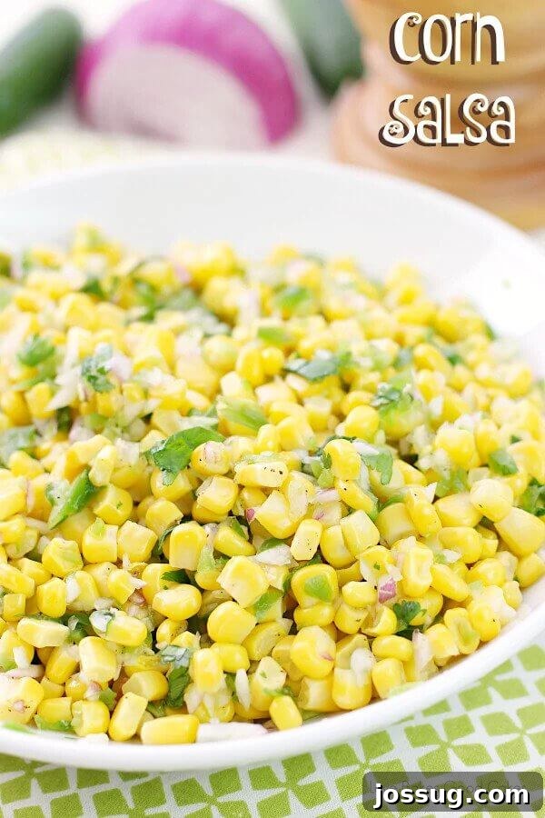 A crisp and colorful bowl of fresh corn salsa with diced red onions and cilantro, ready to be served as an appetizer or side dish.