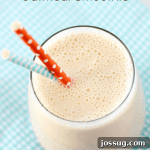 Peach-Banana Oatmeal Smoothie in a glass with two straws.