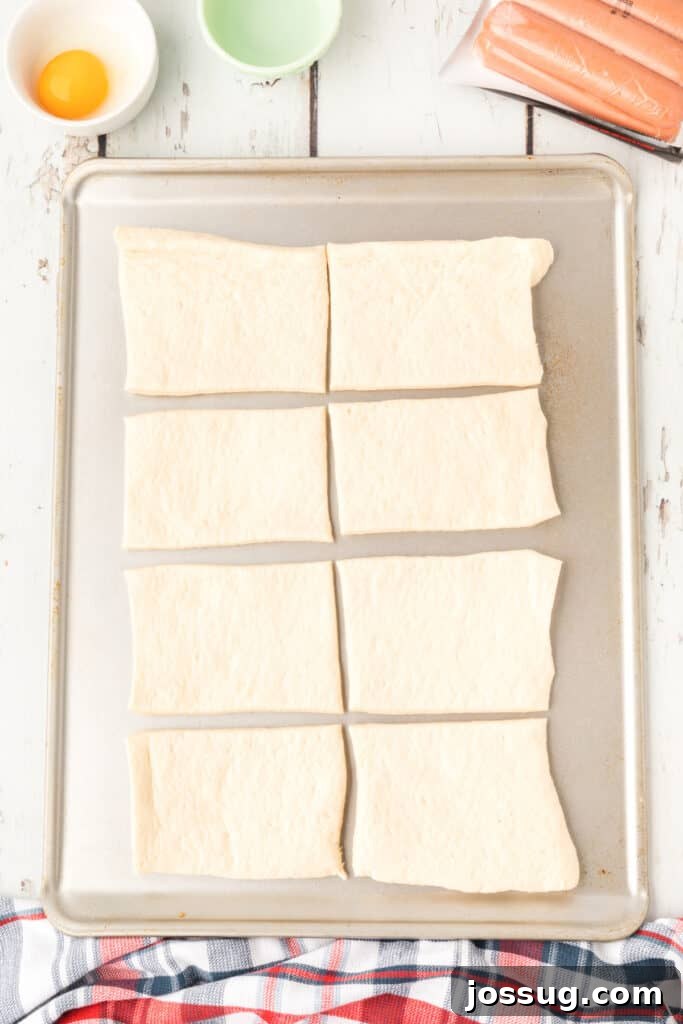 Homemade Pretzel Dogs in a Snap 5 Pizza dough rolled out and cut into 8 even square sections.