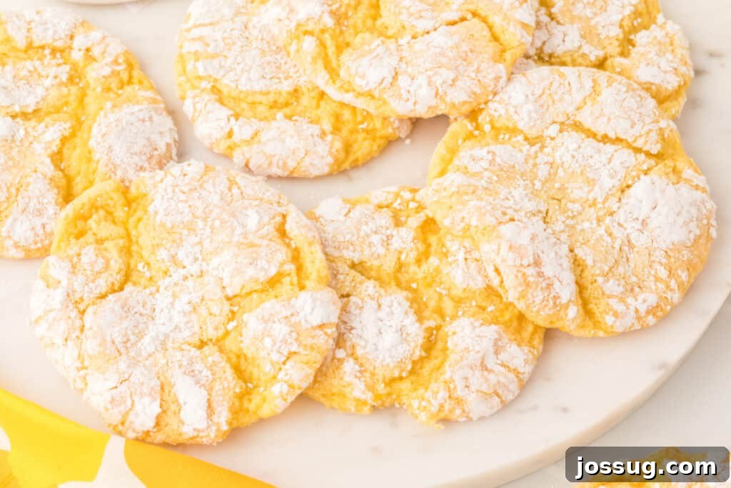 Sunshine Lemon Crinkles 6 A beautifully presented plate of Lemon Crinkle Cookies, highlighting their delicious and inviting appearance.