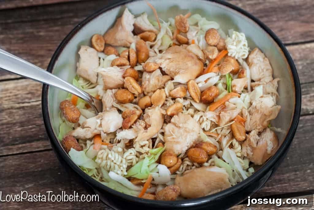 Deliciously Healthy Asian Chicken Salad 4 A close-up shot of Asian Chicken Salad, showing the rich colors of the vegetables, chicken, and mandarins.
