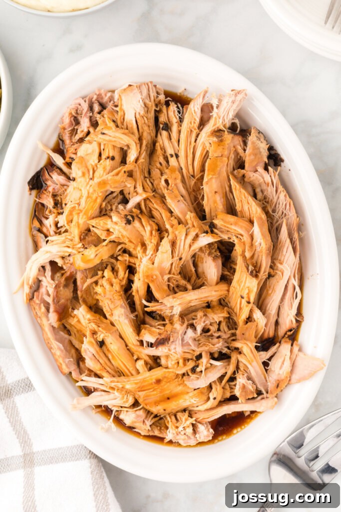 Melt-in-Your-Mouth Slow Cooker Pork 2 A perfectly cooked Slow Cooker Pork Roast, ready to be served as a comforting meal.