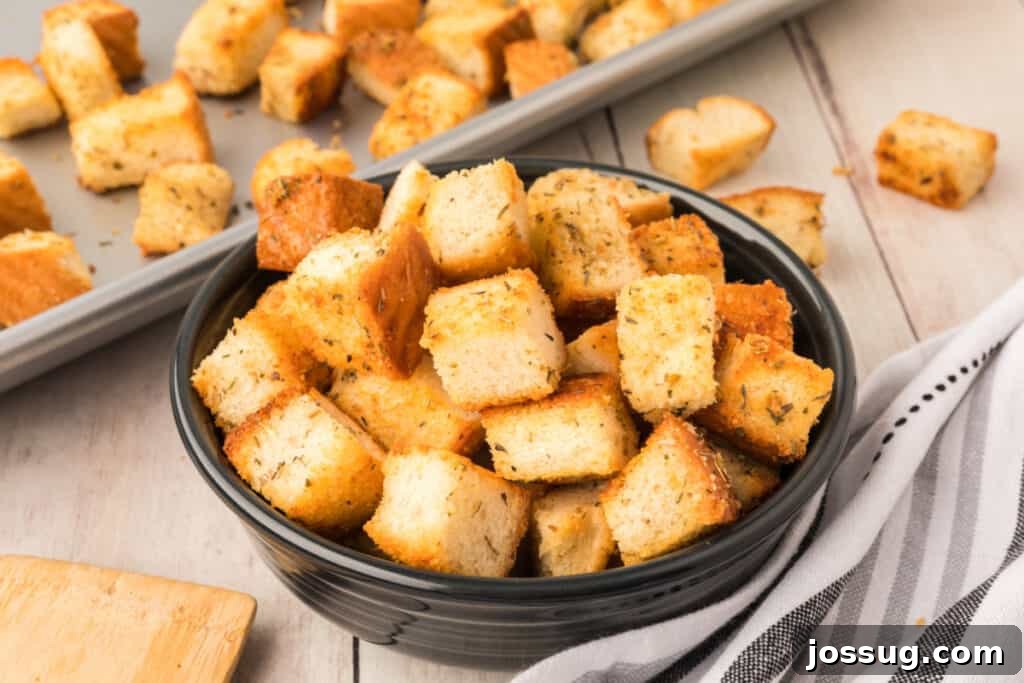 Golden Garlic Parmesan Croutons 5 Closeup of homemade croutons in a rustic bowl, highlighting their golden color and texture.