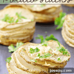 Garlic Parmesan Parslied Potato Stacks on a cutting board.