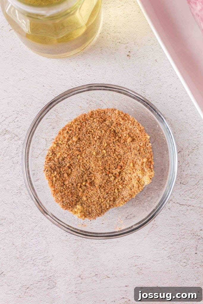 Seasoning mix fully blended in a glass bowl ready for rubbing on the pork