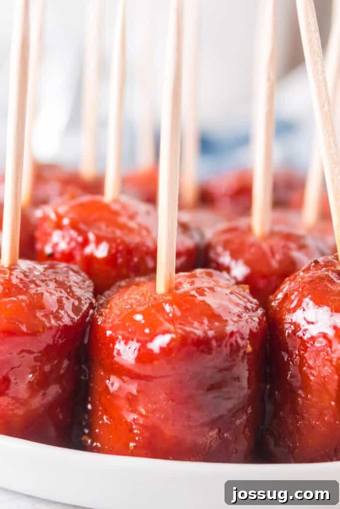 Caramelized Smoked Hot Dog Bites 45 Finished hot dog burnt ends served with toothpicks on a platter, ready to eat