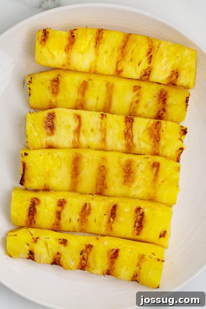 Close-up of grilled pineapple spears with caramelized grill marks